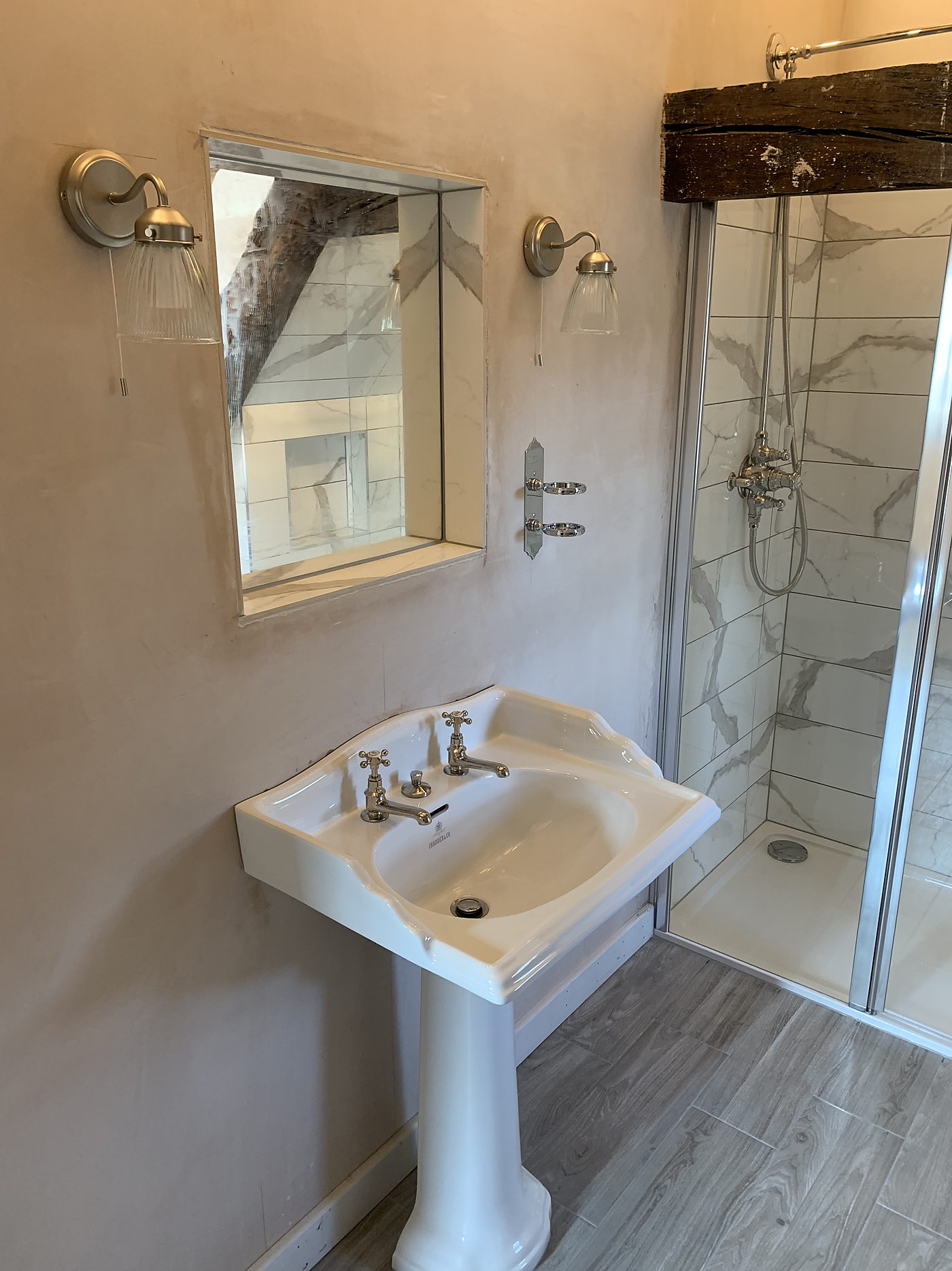 Pedestal basin and shower enclosure in a period bathroom