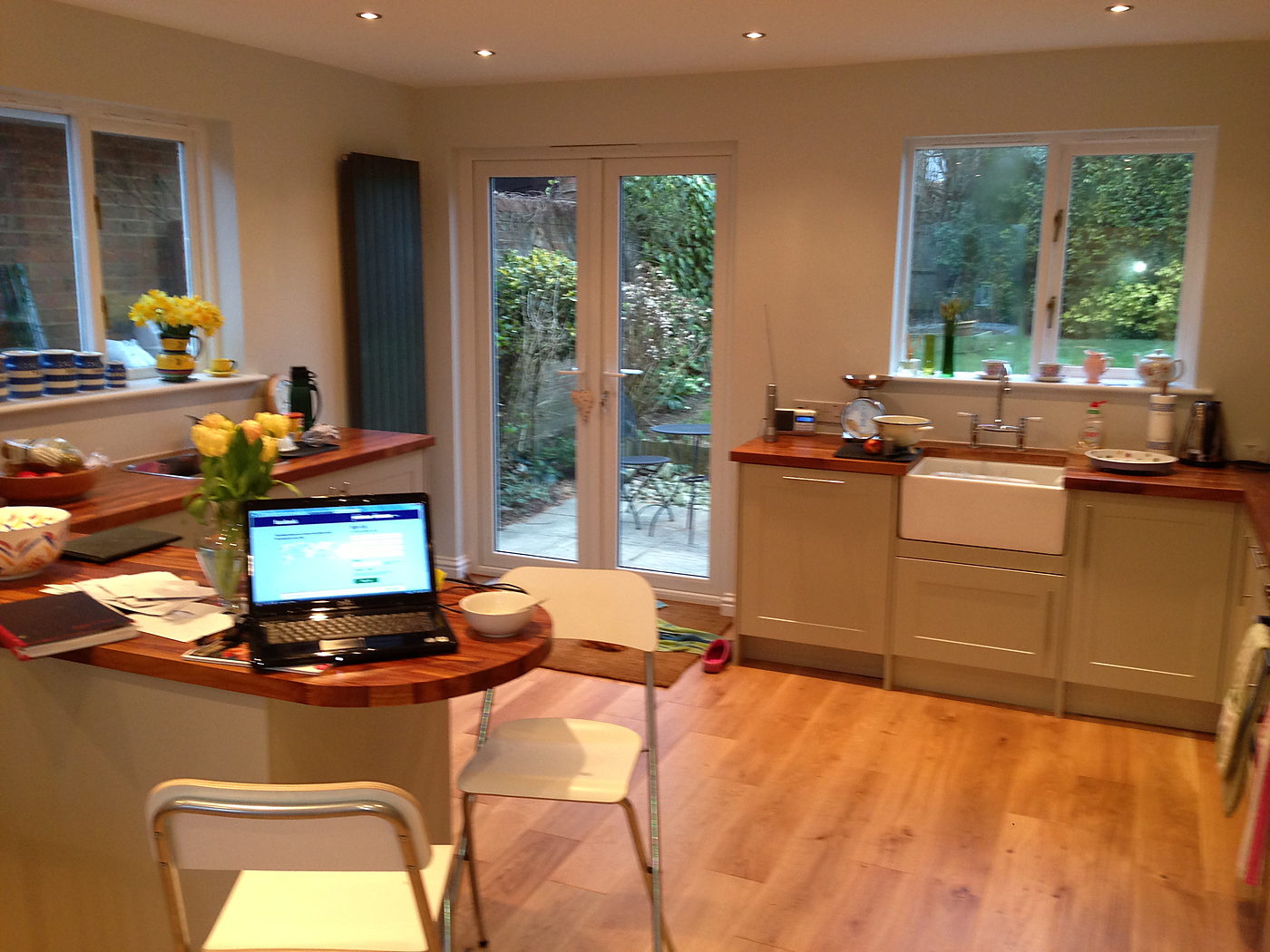 Kitchen diner with a breakfast bar and doors onto the garden
