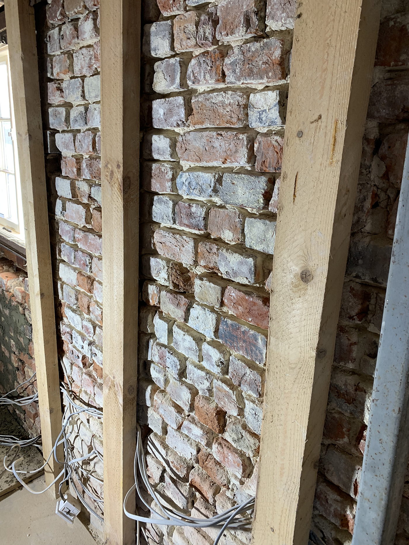 Cable run neatly through the brickwork of a listed building
