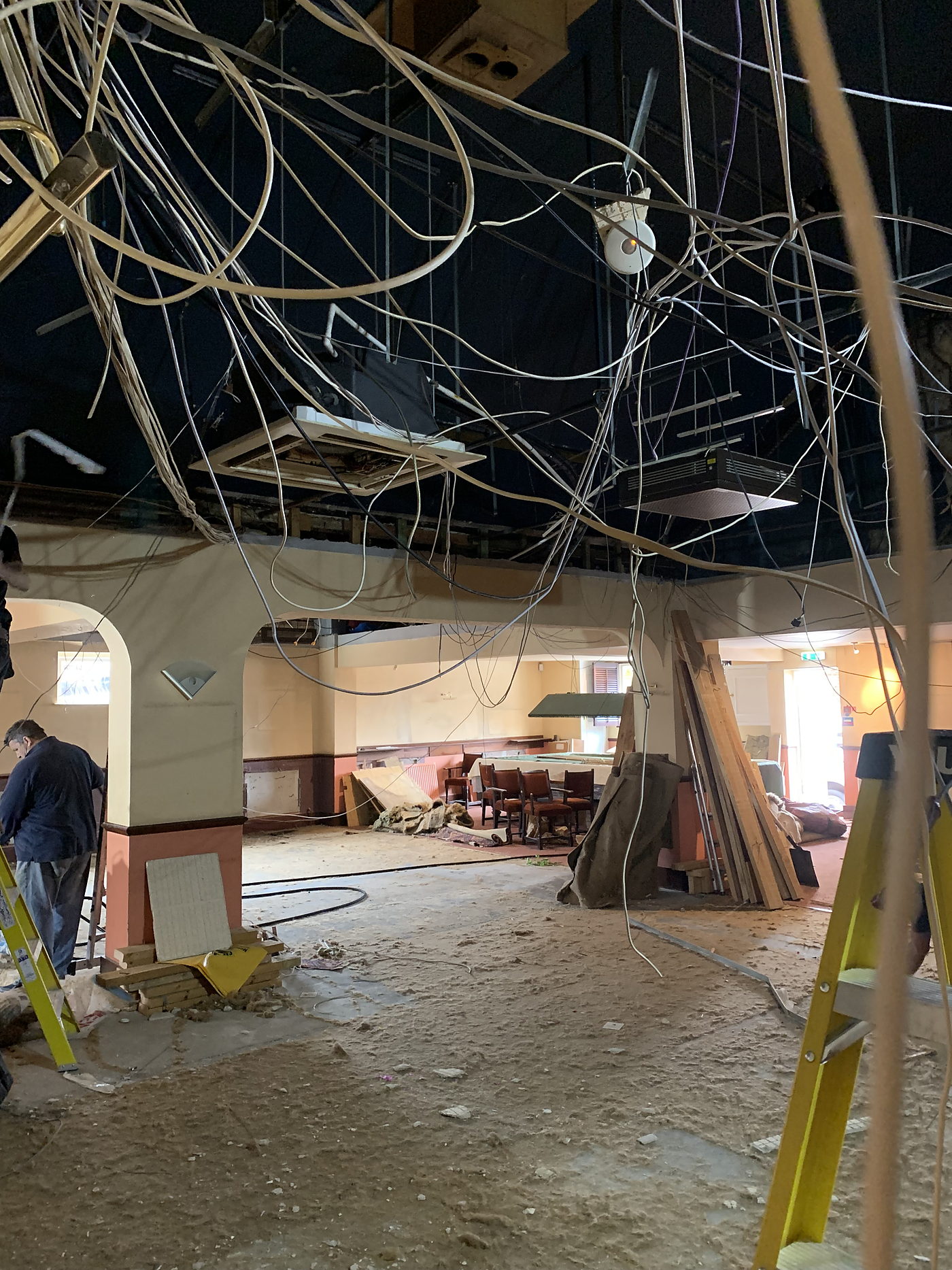Large room stripped back with the old wiring removed from the ceiling