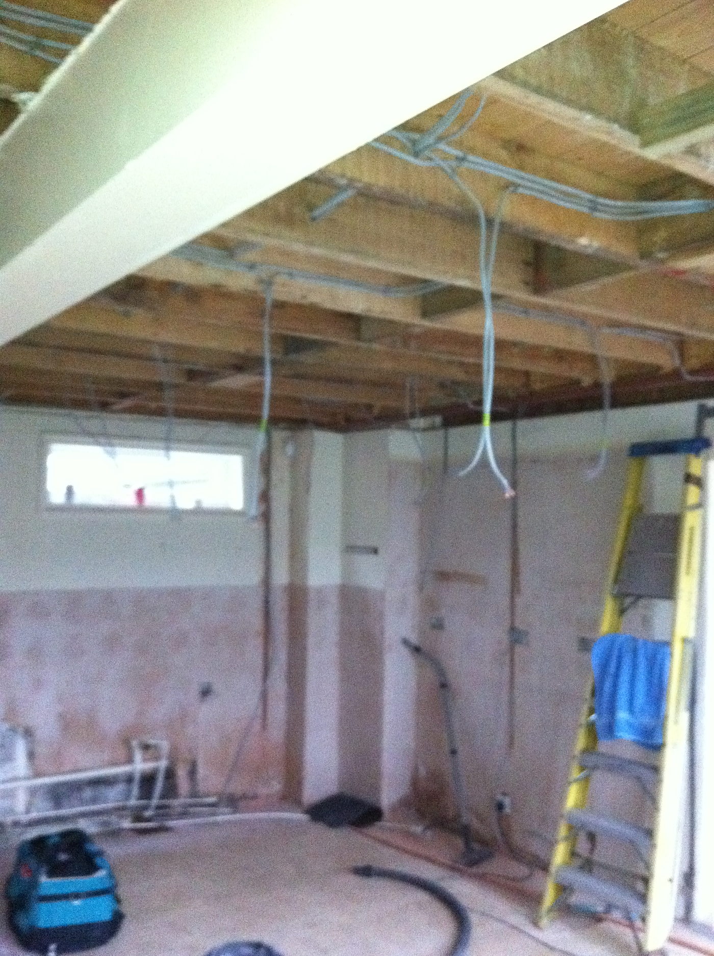 Cables run through the ceiling joists before the plasterboard goes on